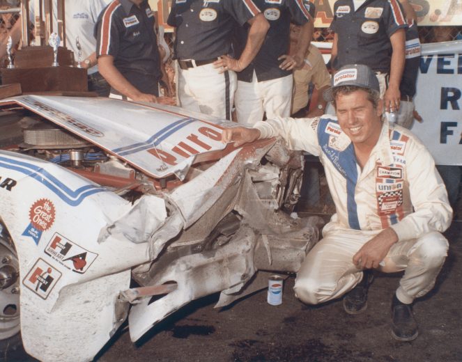DAYTONA BEACH, FL - FEBRUARY 15: David Pearson driver of the #21 Wood Brothers Mercury celebrates in victory lane after winning the 1976 Winston Cup Daytona 500 at the Daytona International Speedway on February 15, 1976 in Daytona Beach, Florida. Pearson crashed with Richard Petty, but was able to drive across the line on the engine's starter motor. (Photo by ISC Archives/CQ-Roll Call Group via Getty Images)