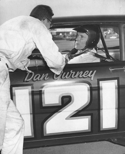RIVERSIDE, CA - JANUARY 17, 1965: Dan Gurney in the Wood Brothers Ford before one of his five wins in the Riverside 500. (Photo by ISC Archives/CQ-Roll Call Group via Getty Images)