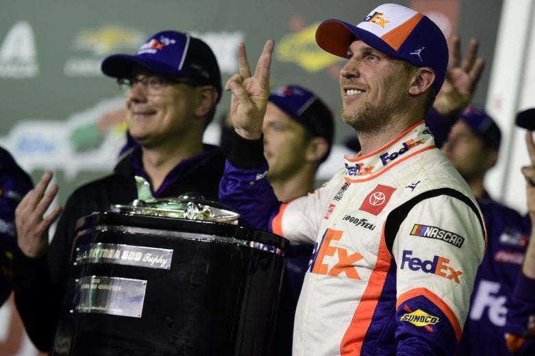 DAYTONA BEACH, FLORIDA - FEBRUARY 17: Denny Hamlin, driver of the #11 FedEx Express Toyota, celebrates in Victory Lane after winning  the NASCAR Cup Series 62nd Annual Daytona 500 at Daytona International Speedway on February 17, 2020 in Daytona Beach, Florida. (Photo by Jared C. Tilton/Getty Images) | Getty Images