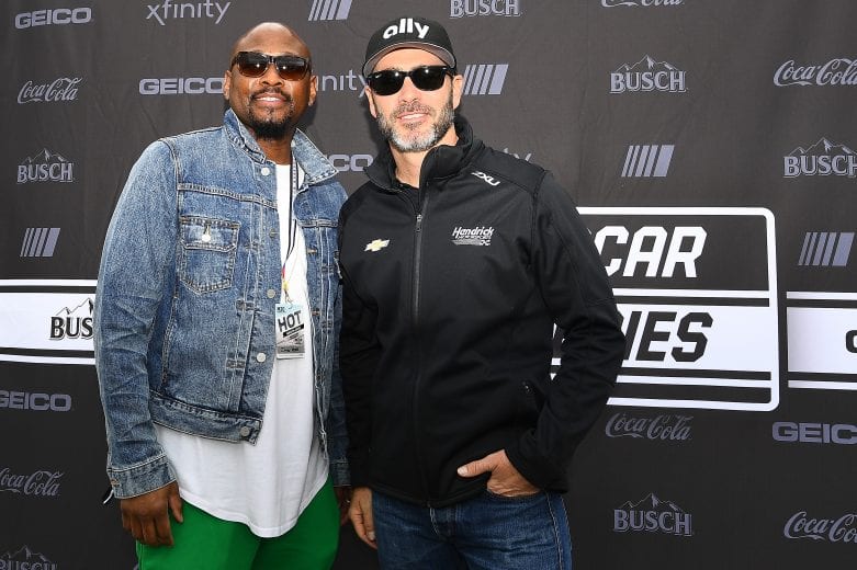 FONTANA, CALIFORNIA - MARCH 01: Jimmie Johnson, driver of the #48 Ally Chevrolet, poses with actor Omar Epps prior to the NASCAR Cup Series Auto Club 400 at Auto Club Speedway on March 01, 2020 in Fontana, California. (Photo by Stacy Revere/Getty Images) | Getty Images