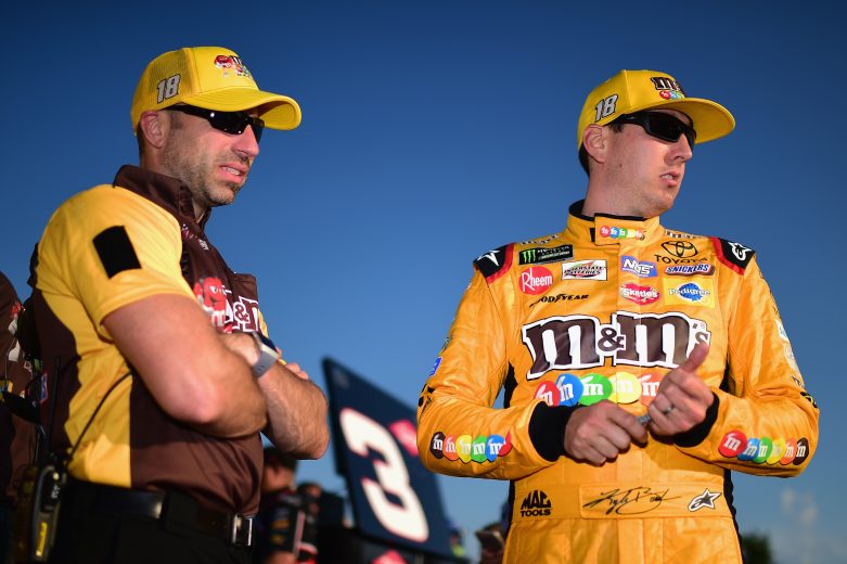 WATKINS GLEN, NY - AUGUST 04:  Kyle Busch, driver of the #18 M&M's Crunchy Mint Toyota, and his crew chief Adam Stevens look on during qualifying for the Monster Energy NASCAR Cup Series GoBowling at The Glen at Watkins Glen International on August 4, 2018 in Watkins Glen, New York.  (Photo by Jared C. Tilton/Getty Images) | Getty Images
