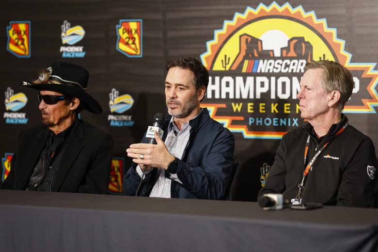 AVONDALE, ARIZONA - NOVEMBER 04: Former NASCAR driver, Jimmie Johnson (C) speaks to the media announcing he has invested in an ownership stake in the Petty GMS Motorsports as team owners Richard Petty (L) and Maury Gallagher (R) look on during a press conference at Phoenix Raceway on November 04, 2022 in Avondale, Arizona. (Photo by Chris Graythen/Getty Images) | Getty Images