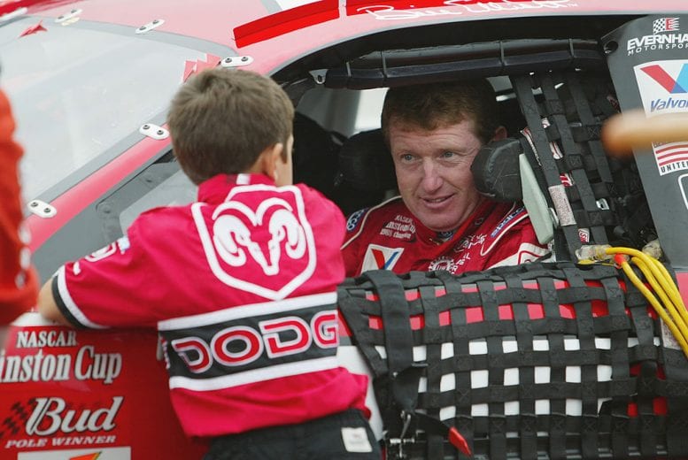 LONG POND, PA - JULY 28: Bill Elliott, driver of the #9 Evernham Motorsports Dodge Intrepid R/T, talks with son Chase during the NASCAR Winston Cup Series Pennsylavania 500 on July 28, 2002 at Pocono Raceway in Long Pond, Pennsylvania. (Photo by Jamie Squire/Getty Images) | Getty Images
