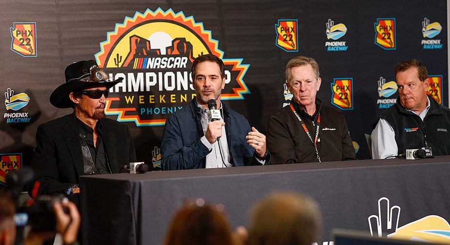 richard petty, jimmie johnson and maury gallagher at a press conference