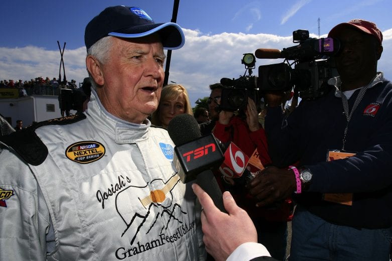 DAYTONA, FL - FEBRUARY 15: James Hylton, driver of the #58 Retirement Living TV Chevrolet, speaks to the media, prior to the Gatorade Duel at Daytona International Speedway on February 15, 2007 in Daytona, Florida. (Photo by Jamie Squire/Getty Images for NASCAR) | Getty Images