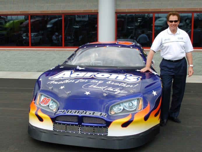 Darrell Waltrip shows off the car he will race in Martinsville in the NASCAR NEXTEL Cup series. Waltrip displayed the car outside the press center at the Coca-Cola 600 May 26, 2006 at Lowe's Motor Speedway in Charlotte. (Photo by A. Messerschmidt/Getty Images)
