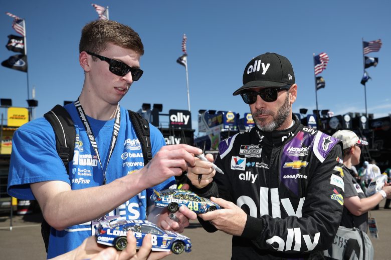 AVONDALE, ARIZONA - MARCH 06: Jimmie Johnson, driver of the #48 Ally Chevrolet, signs autographs for fans during practice for the NASCAR Cup Series FanShield 500 at Phoenix Raceway on March 06, 2020 in Avondale, Arizona. (Photo by Christian Petersen/Getty Images) | Getty Images