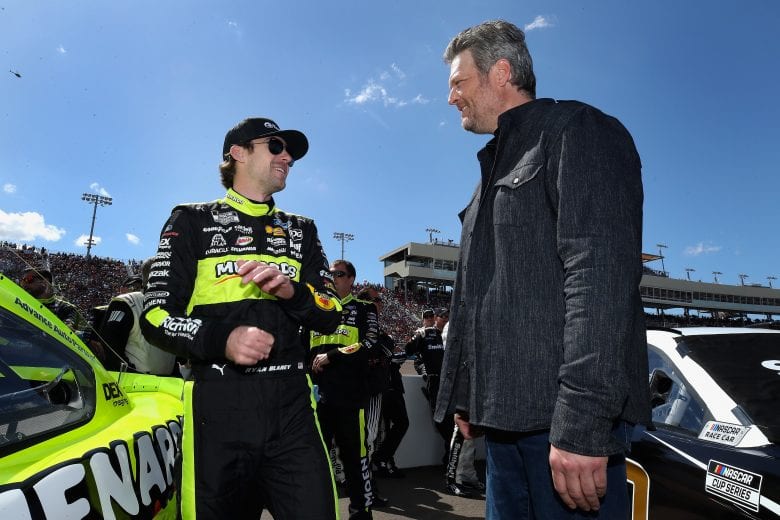 AVONDALE, ARIZONA - MARCH 08: Ryan Blaney, driver of the #12 Menards/Tarkett Ford, talks with singer Blake Shelton on the grid before the NASCAR Cup Series FanShield 500 at Phoenix Raceway on March 08, 2020 in Avondale, Arizona. (Photo by Christian Petersen/Getty Images) | Getty Images