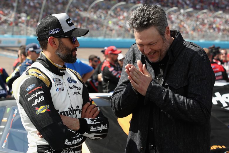 AVONDALE, ARIZONA - MARCH 08: Aric Almirola, driver of the #10 Smithfield Ford, talks with singer Blake Shelton on the grid before the NASCAR Cup Series FanShield 500 at Phoenix Raceway on March 08, 2020 in Avondale, Arizona. (Photo by Christian Petersen/Getty Images) | Getty Images