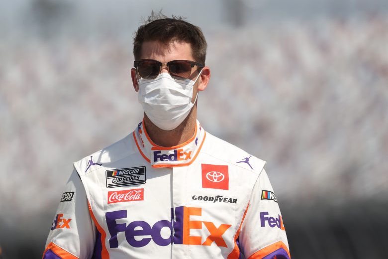 DARLINGTON, SOUTH CAROLINA - MAY 17:  Denny Hamlin, driver of the #11 FedEx Thank You Toyota, walks pit road prior to the NASCAR Cup Series The Real Heroes 400 at Darlington Raceway on May 17, 2020 in Darlington, South Carolina. NASCAR resumes the season after the nationwide lockdown due to the ongoing coronavirus (COVID-19).  (Photo by Chris Graythen/Getty Images) | Getty Images