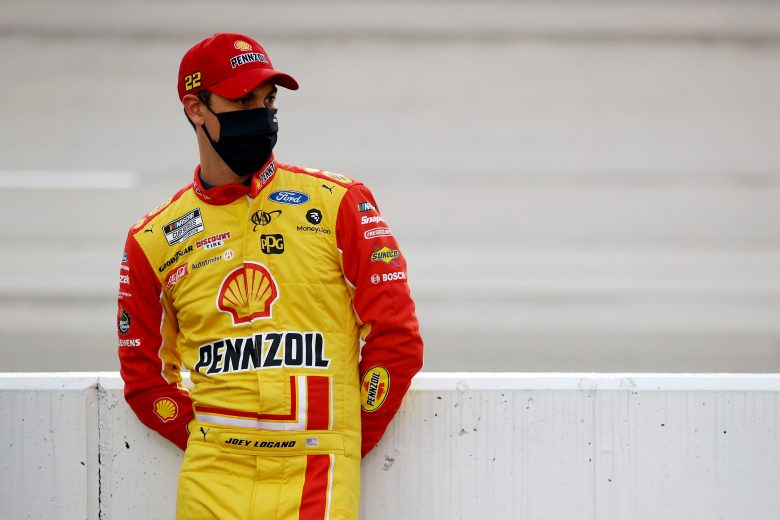 DARLINGTON, SOUTH CAROLINA - MAY 20: Joey Logano, driver of the #22 Shell Pennzoil Ford, stands on the grid prior to the NASCAR Cup Series Toyota 500 at Darlington Raceway on May 20, 2020 in Darlington, South Carolina. (Photo by Chris Graythen/Getty Images) | Getty Images