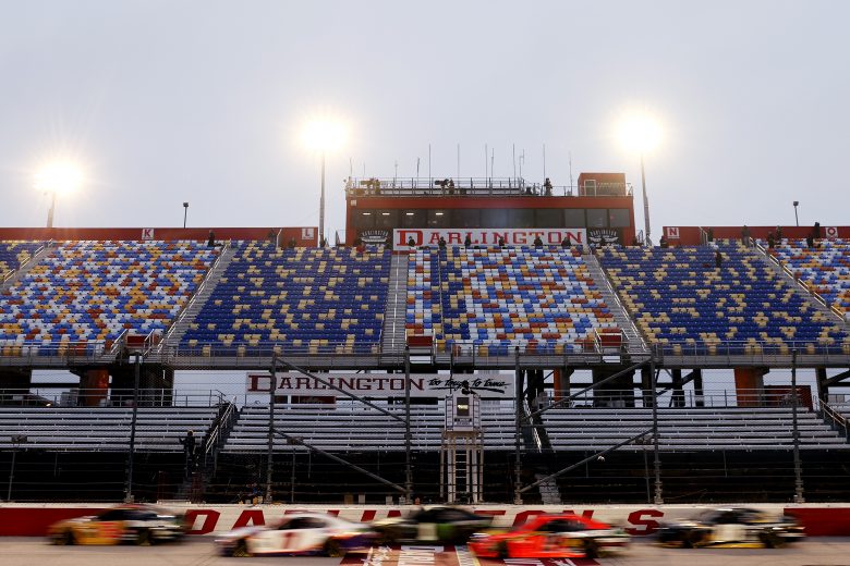 DARLINGTON, SOUTH CAROLINA - MAY 20: Cars drive past the empty grandstands during the NASCAR Cup Series Toyota 500 at Darlington Raceway on May 20, 2020 in Darlington, South Carolina. (Photo by Chris Graythen/Getty Images) | Getty Images