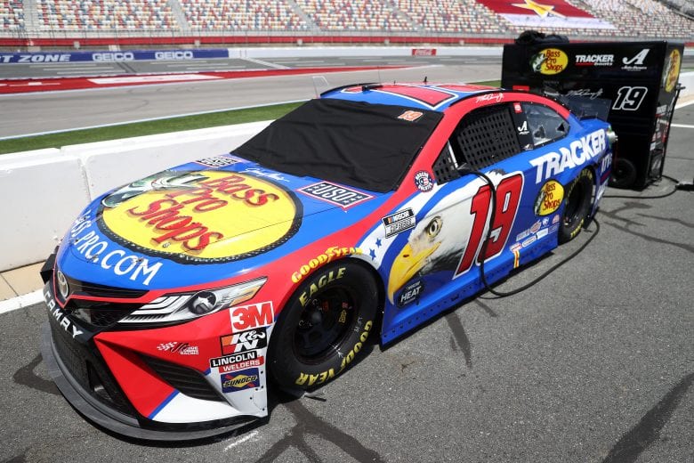 CONCORD, NORTH CAROLINA - MAY 24: The #19 Bass Pro Shops/TRACKER/USO Toyota, driven by Martin Truex Jr. sits on the grid prior to the NASCAR Cup Series Coca-Cola 600 at Charlotte Motor Speedway on May 24, 2020 in Concord, North Carolina. (Photo by Chris Graythen/Getty Images) | Getty Images