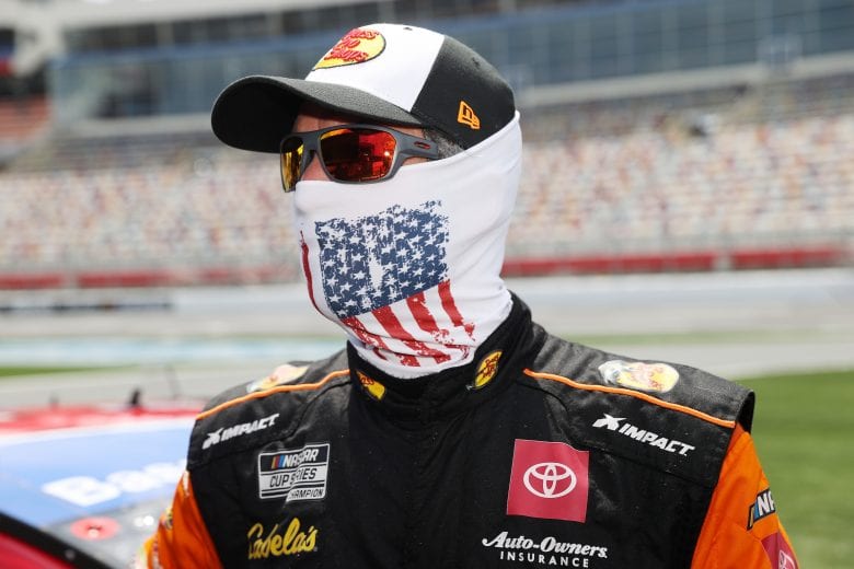 CONCORD, NORTH CAROLINA - MAY 24: Martin Truex Jr., driver of the #19 Bass Pro Shops/TRACKER/USO Toyota, stands on the grid during qualifying for the NASCAR Cup Series Coca-Cola 600 at Charlotte Motor Speedway on May 24, 2020 in Concord, North Carolina. (Photo by Chris Graythen/Getty Images) | Getty Images