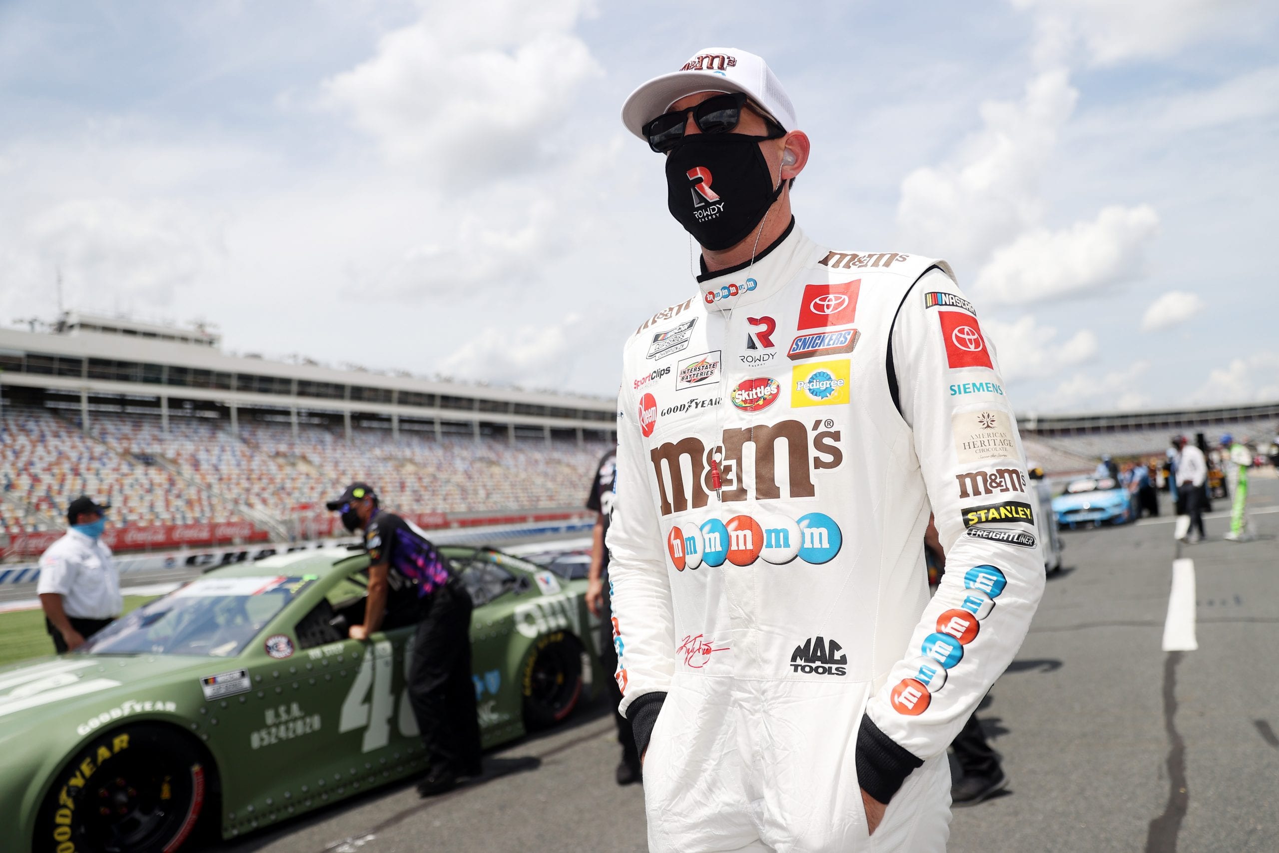 CONCORD, NORTH CAROLINA - MAY 24: Kyle Busch, driver of the #18 M&M's Red White Blue Toyota, walks the grid during qualifying for the NASCAR Cup Series Coca-Cola 600 at Charlotte Motor Speedway on May 24, 2020 in Concord, North Carolina. (Photo by Chris Graythen/Getty Images) | Getty Images