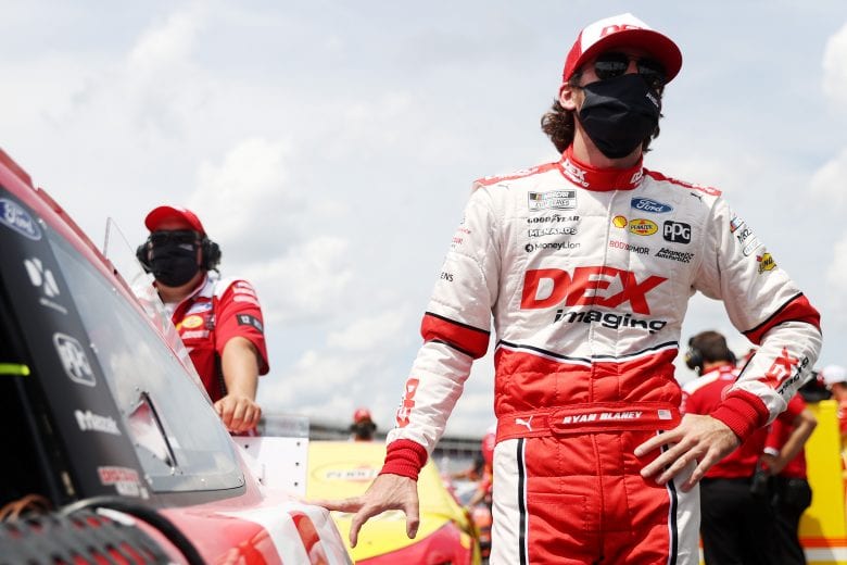 CONCORD, NORTH CAROLINA - MAY 24: Ryan Blaney, driver of the #12 DEX Imaging Ford, stands on the grid during qualifying for the NASCAR Cup Series Coca-Cola 600 at Charlotte Motor Speedway on May 24, 2020 in Concord, North Carolina. (Photo by Chris Graythen/Getty Images) | Getty Images