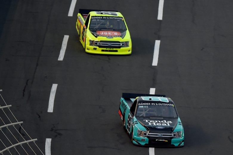 CONCORD, NORTH CAROLINA - MAY 26: Ben Rhodes, driver of the #99 Tenda Heal Ford, leads Matt Crafton, driver of the #88 Oklahoma Joe's Smokers/Menards Ford, during  the NASCAR Gander Outdoors Trucks Series North Carolina Education Lottery 200 at Charlotte Motor Speedway on May 26, 2020 in Concord, North Carolina. (Photo by Jared C. Tilton/Getty Images) | Getty Images