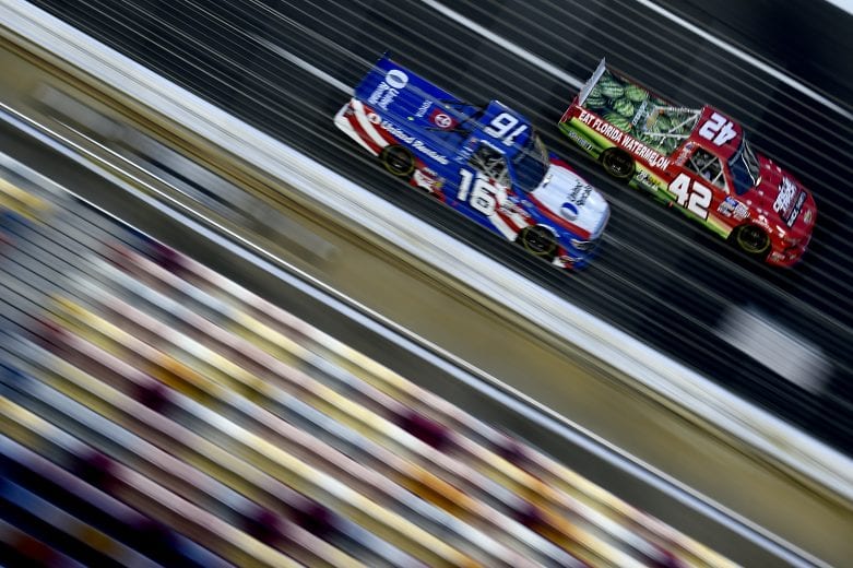 CONCORD, NORTH CAROLINA - MAY 26: Ross Chastain, driver of the #42 Florida Watermelon Association Chevrolet, leads Austin Hill, driver of the #16 United Rentals Toyota, during the NASCAR Gander Outdoors Trucks Series North Carolina Education Lottery 200 at Charlotte Motor Speedway on May 26, 2020 in Concord, North Carolina. (Photo by Jared C. Tilton/Getty Images) | Getty Images