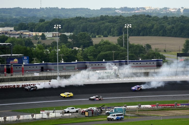 CONCORD, NORTH CAROLINA - MAY 28: Garrett Smithley, driver of the #53 Chevrolet, and Joey Gase, driver of the #51 Ford, spin to start the NASCAR Cup Series Alsco Uniforms 500 at Charlotte Motor Speedway on May 28, 2020 in Concord, North Carolina. (Photo by Jared C. Tilton/Getty Images) | Getty Images