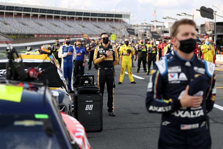 CONCORD, NORTH CAROLINA - MAY 28: Alex Bowman, driver of the #88 ChevyGoods.com/NOCO Chevrolet, stands for the national anthem prior to the NASCAR Cup Series Alsco Uniforms 500 at Charlotte Motor Speedway on May 28, 2020 in Concord, North Carolina. (Photo by Chris Graythen/Getty Images) | Getty Images