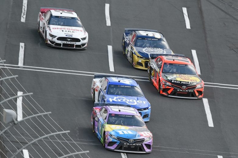CONCORD, NORTH CAROLINA - MAY 28: Kyle Busch, driver of the #18 M&M's Fudge Brownie Toyota, leads a pack of cars during the NASCAR Cup Series Alsco Uniforms 500 at Charlotte Motor Speedway on May 28, 2020 in Concord, North Carolina. (Photo by Jared C. Tilton/Getty Images) | Getty Images