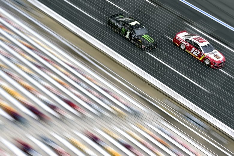 CONCORD, NORTH CAROLINA - MAY 28: Ryan Blaney, driver of the #12 BodyArmor Ford, leads Kurt Busch, driver of the #1 Monster Energy Chevrolet, during the NASCAR Cup Series Alsco Uniforms 500 at Charlotte Motor Speedway on May 28, 2020 in Concord, North Carolina. (Photo by Jared C. Tilton/Getty Images) | Getty Images
