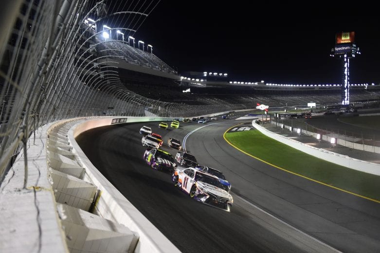 CONCORD, NORTH CAROLINA - MAY 28: Denny Hamlin, driver of the #11 FedEx SupportSmall Toyota, leads a pack of cars during the NASCAR Cup Series Alsco Uniforms 500 at Charlotte Motor Speedway on May 28, 2020 in Concord, North Carolina. (Photo by Jared C. Tilton/Getty Images) | Getty Images