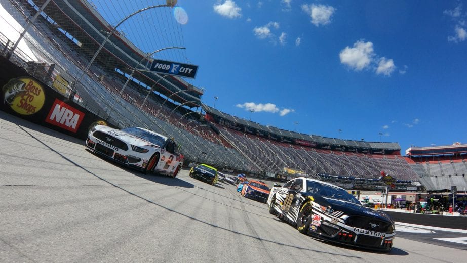 BRISTOL, TENNESSEE - MAY 31: Brad Keselowski, driver of the #2 Discount Tire Ford,and Aric Almirola, driver of the #10 Smithfield Ford, lead the field at the start of the NASCAR Cup Series Food City presents the Supermarket Heroes 500 at Bristol Motor Speedway on May 31, 2020 in Bristol, Tennessee. (Photo by Jared C. Tilton/Getty Images) | Getty Images