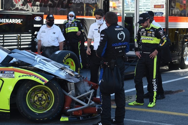 BRISTOL, TENNESSEE - MAY 31: Ryan Blaney, driver of the #12 Menards/Richmond Ford, and crew work on the car after a spin impact during the NASCAR Cup Series Food City presents the Supermarket Heroes 500 at Bristol Motor Speedway on May 31, 2020 in Bristol, Tennessee. (Photo by Jared C. Tilton/Getty Images) | Getty Images