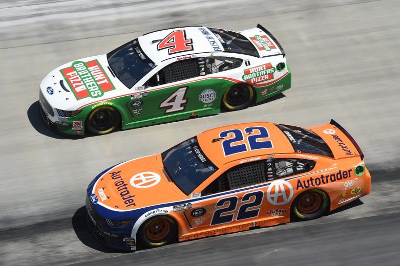 BRISTOL, TENNESSEE - MAY 31: Kevin Harvick, driver of the #4 Hunt Brothers Pizza Ford, leads Joey Logano, driver of the #22 Autotrader Ford, during the NASCAR Cup Series Food City presents the Supermarket Heroes 500 at Bristol Motor Speedway on May 31, 2020 in Bristol, Tennessee. (Photo by Jared C. Tilton/Getty Images) | Getty Images
