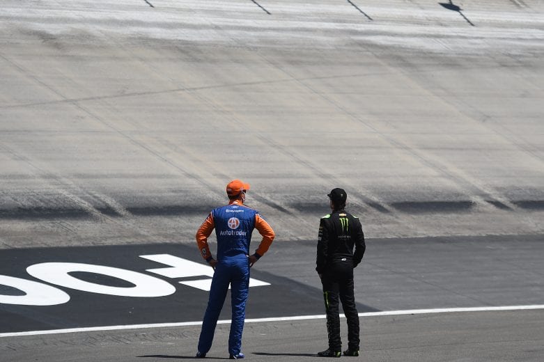 BRISTOL, TENNESSEE - MAY 31: Joey Logano, driver of the #22 Autotrader Ford, and Kurt Busch, driver of the #1 Chevrolet, stand on the track prior to the NASCAR Cup Series Food City presents the Supermarket Heroes 500 at Bristol Motor Speedway on May 31, 2020 in Bristol, Tennessee. (Photo by Jared C. Tilton/Getty Images) | Getty Images