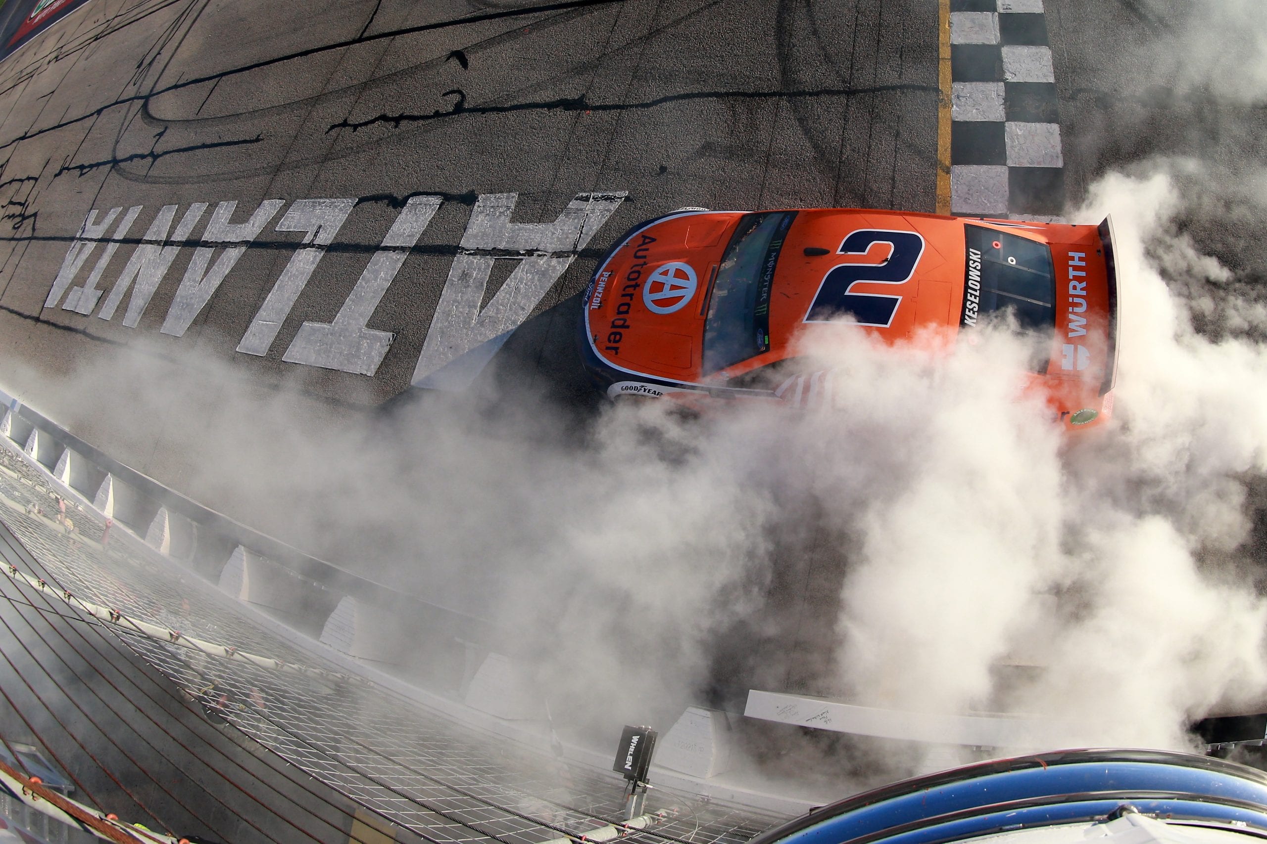 HAMPTON, GA - FEBRUARY 24:  Brad Keselowski, driver of the #2 Autotrader Ford, celebrates with a burnout after winning the Monster Energy NASCAR Cup Series Folds of Honor QuikTrip 500 at Atlanta Motor Speedway on February 24, 2019 in Hampton, Georgia.  (Photo by Sean Gardner/Getty Images) | Getty Images