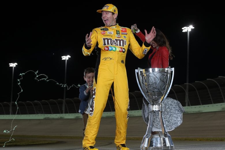 HOMESTEAD, FLORIDA - NOVEMBER 17: Kyle Busch, driver of the #18 M&M's Toyota along with his wife Samantha and son Brexton pose with the trophy after winning the Monster Energy NASCAR Cup Series Championship at Homestead Speedway on November 17, 2019 in Homestead, Florida. (Photo by Chris Graythen/Getty Images) | Getty Images
