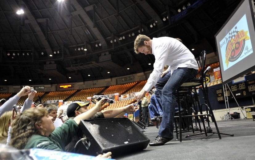 NASHVILLE, TN - JANUARY 9: Dale Earnhardt Jr., driver of the #88 National Guard/Amp Energy Chevrolet, signs autographs before a Q&A session during the fifth annual Sprint Sound and Speed Fan Festival at Nashville Municipal Auditorium on January 9, 2010 in Nashville, Tennessee. (Photo by Grant Halverson/Getty Images for NASCAR) | Getty Images