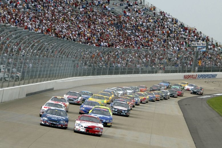 LEBANON, TN - APRIL 15: Denny Hamlin (R), driver of the #20 Rockwell Automation Chevrolet, and Clint Bowyer, driver of the #2 ACDelco Chevrolet, lead the field at the start of the Nascar Busch Series Pepsi 300 on Saturday, April 15 2006, at the Nashville Superspeedway in Lebanon, Tennessee. (Photo by Todd Warshaw/Getty Images For Nascar) | Getty Images