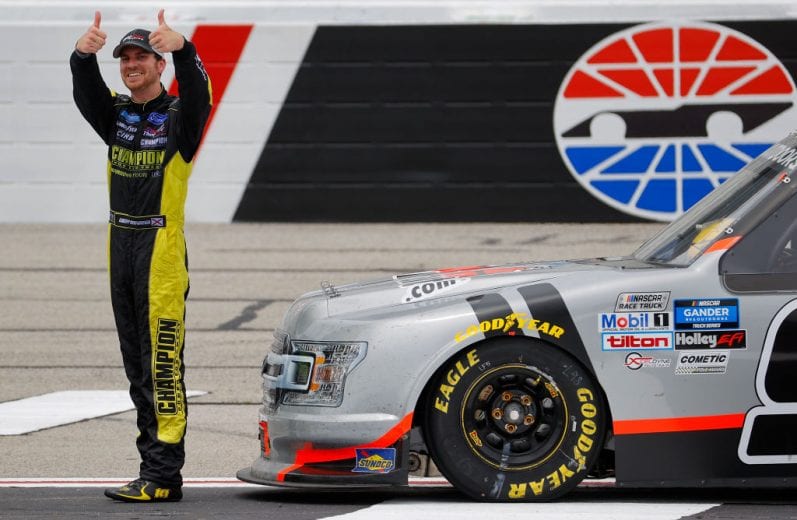 HAMPTON, GEORGIA - JUNE 06: Grant Enfinger, driver of the #98 Farm Paint Ford, celebrates after winning the NASCAR Gander Outdoors Truck Series Vet Tix Camping World 200 at Atlanta Motor Speedway on June 06, 2020 in Hampton, Georgia. (Photo by Chris Graythen/Getty Images) | Getty Images