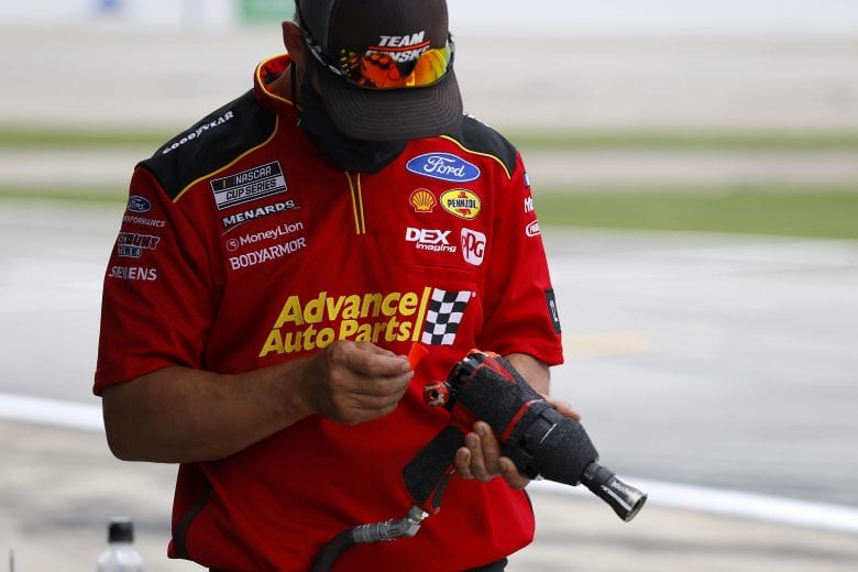 HAMPTON, GEORGIA - JUNE 07: A crew member for Ryan Blaney, driver of the #12 Advance Auto Parts Ford, prepares for the NASCAR Cup Series Folds of Honor QuikTrip 500 at Atlanta Motor Speedway on June 07, 2020 in Hampton, Georgia. (Photo by Kevin C. Cox/Getty Images) | Getty Images