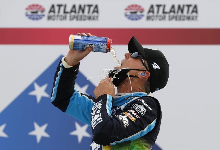 HAMPTON, GEORGIA - JUNE 07: Kevin Harvick, driver of the #4 Busch Light For The Farmers Ford, celebrates in Victory Lane after winning the NASCAR Cup Series Folds of Honor QuikTrip 500 at Atlanta Motor Speedway on June 07, 2020 in Hampton, Georgia. (Photo by Chris Graythen/Getty Images) | Getty Images