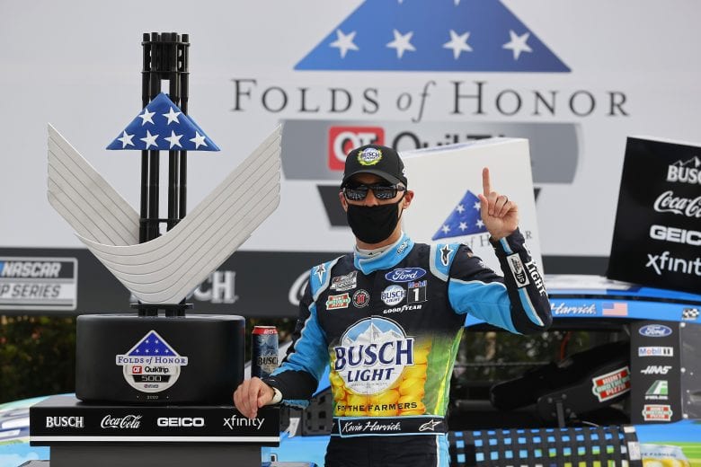 HAMPTON, GEORGIA - JUNE 07: Kevin Harvick, driver of the #4 Busch Light For The Farmers Ford, celebrates in Victory Lane after winning the NASCAR Cup Series Folds of Honor QuikTrip 500 at Atlanta Motor Speedway on June 07, 2020 in Hampton, Georgia. (Photo by Chris Graythen/Getty Images) | Getty Images