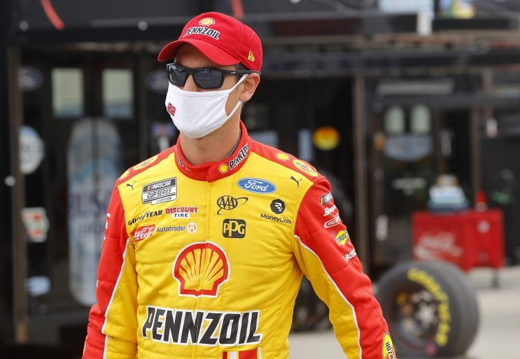 HAMPTON, GEORGIA - JUNE 07: Joey Logano, driver of the #22 Shell Pennzoil Ford, walks the grid prior to the NASCAR Cup Series Folds of Honor QuikTrip 500 at Atlanta Motor Speedway on June 07, 2020 in Hampton, Georgia. (Photo by Chris Graythen/Getty Images) | Getty Images