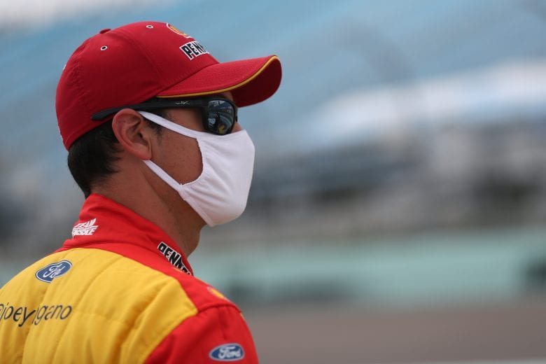 HOMESTEAD, FLORIDA - JUNE 14: Joey Logano, driver of the #22 Shell Pennzoil Ford, stands on the grid prior to the NASCAR Cup Series Dixie Vodka 400 at Homestead-Miami Speedway on June 14, 2020 in Homestead, Florida. (Photo by Chris Graythen/Getty Images) | Getty Images