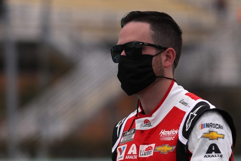 HOMESTEAD, FLORIDA - JUNE 14: Alex Bowman, driver of the #88 LLUMAR Chevrolet, walks on the grid prior to the NASCAR Cup Series Dixie Vodka 400 at Homestead-Miami Speedway on June 14, 2020 in Homestead, Florida. (Photo by Chris Graythen/Getty Images) | Getty Images