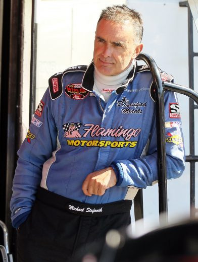 LAKEVILLE, CT - SEPTEMBER 16:  Mike Stefanik , driver of the #16 Diversified Metals/R.B. Enterprises Ford looks on during practice for the Whelen Modified 66/99 pres. by Town Fair Tire of the NASCAR Whelen Modified Tour on September 16, 2011 at Lime Rock Park in Lakeville, Connecticut.  (Photo by Jim McIsaac/Getty Images for NASCAR) *** Local Caption *** Mike Stefanik | Getty Images