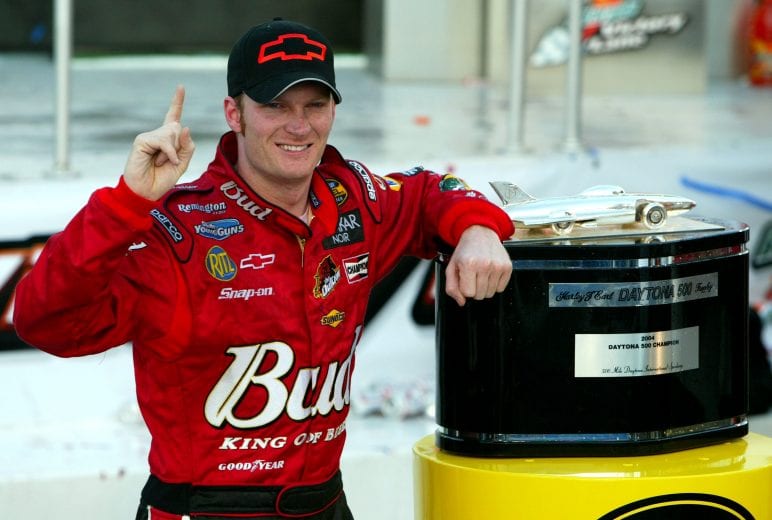 DAYTONA BEACH, FL - FEBRUARY 15: Dale Earnhardt Jr. driver of the #8 DEI Budweiser Chevrolet poses with the Harvey J. Earl Daytona 500 Trophy in victory circle after winning the NASCAR Nextel Cup Daytona 500 on February 15, 2004 at the Daytona International Speedway in Daytona Beach, Florida. (Photo by Robert Laberge/Getty Images) | Getty Images