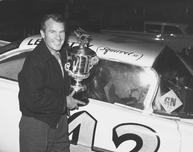 DAYTONA BEACH, FL - FEBRUARY 25: Lee Petty driver of the #42 Oldsmobile poses in front of his car after winning the first 1959 Winston Cup Daytona 500 race at the Daytona International Speedway on February 25, 1959 in Daytona Beach, Florida. Petty was not awarded the trophy until three days later after officals thought Johnny Beauchamp was the winner. (Photo by ISC Archives/CQ-Roll Call Group via Getty Images)
