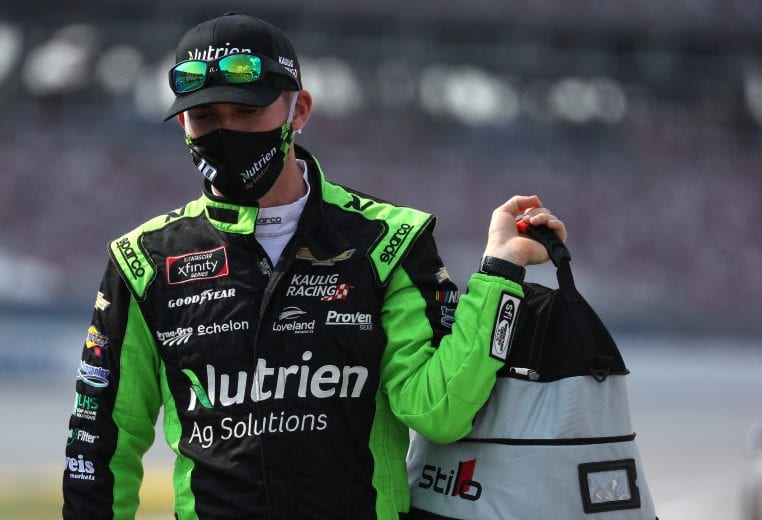 TALLADEGA, ALABAMA - JUNE 20: Harrison Burton, driver of the #20 Morton Buildings/DEX Imaging Toyota, walks the grid prior to the NASCAR Xfinity Series Unhinged 300 at Talladega Superspeedway on June 20, 2020 in Talladega, Alabama. (Photo by Chris Graythen/Getty Images) | Getty Images