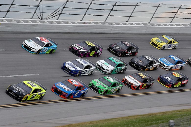 TALLADEGA, ALABAMA - JUNE 22: Ryan Blaney, driver of the #12 Menards/Sylvania Ford, Brad Keselowski, driver of the #2 Dent Wizard Ford, and Bubba Wallace, driver of the #43 Victory Junction Chevrolet, lead a pack of cars during the NASCAR Cup Series GEICO 500 at Talladega Superspeedway on June 22, 2020 in Talladega, Alabama. (Photo by Chris Graythen/Getty Images) | Getty Images