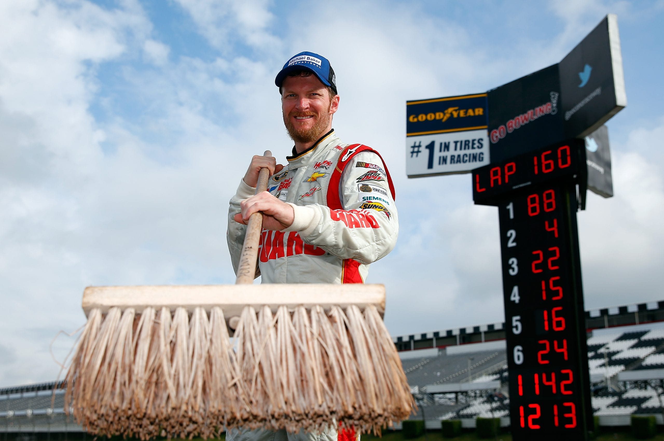 LONG POND, PA - AUGUST 03:  Dale Earnhardt Jr., driver of the #88 Michael Baker International Chevrolet, poses after winning the NASCAR Sprint Cup Series GoBowling.com 400 at Pocono Raceway on August 3, 2014 in Long Pond, Pennsylvania.  (Photo by Tom Pennington/NASCAR via Getty Images)