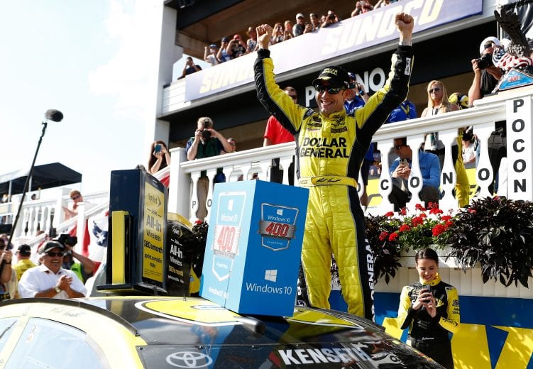 LONG POND, PA - AUGUST 02: Matt Kenseth, driver of the #20 Dollar General Toyota, celebrates in Victory Lane after winning the NASCAR Sprint Cup Series Windows 10 400 at Pocono Raceway on August 2, 2015 in Long Pond, Pennsylvania. (Photo by Jeff Zelevansky/NASCAR via Getty Images)