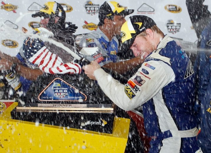 LONG POND, PA - AUGUST 01: Chris Buescher, driver of the #34 Dockside Logistics Ford, celebrates in victory lane after winning the NASCAR Sprint Cup Series Pennsylvania 400 at Pocono Raceway on August 1, 2016 in Long Pond, Pennsylvania. The race was delayed due to inclement weather on Sunday, July 31. (Photo by Brian Lawdermilk/Getty Images) | Getty Images